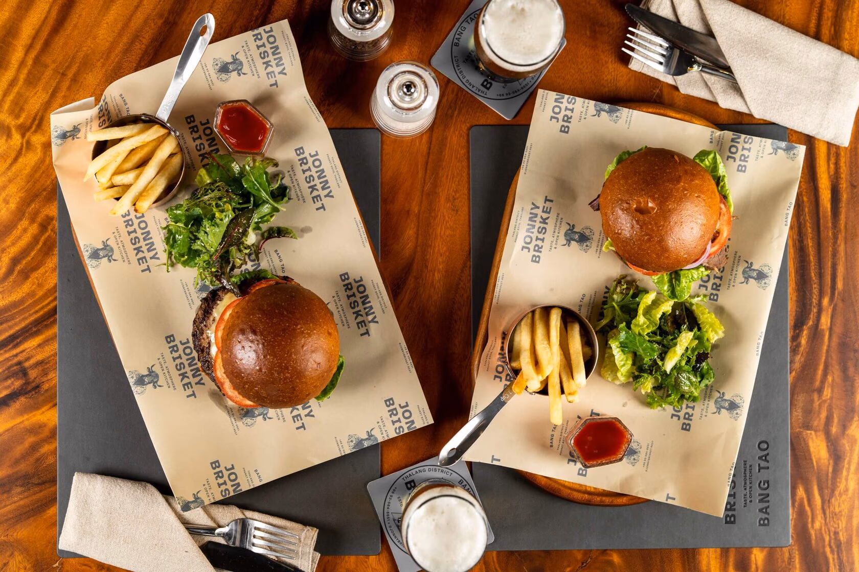 Burgers on boards at Jonny Brisket