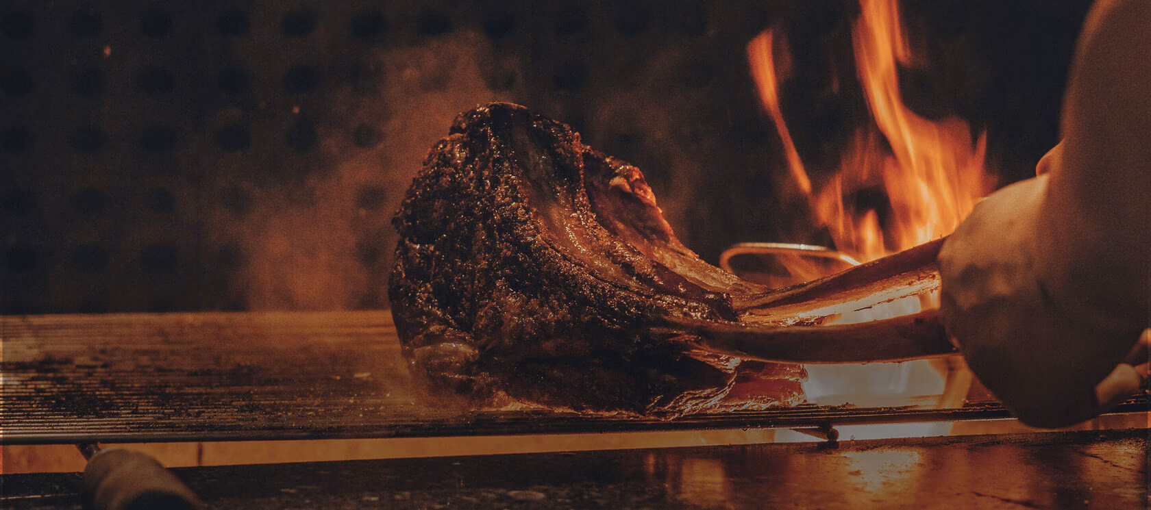 Ribs and beef over open flame at Jonny Brisket